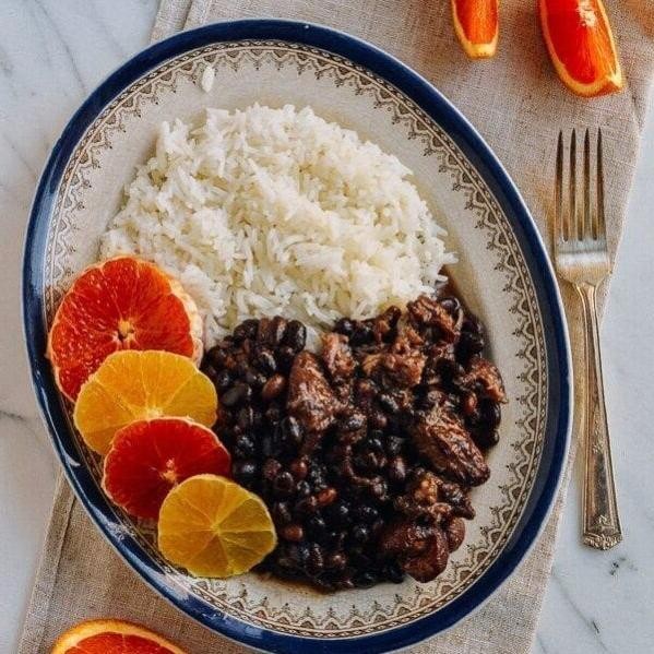 Feijoada Stew with Orange Slices and Fresh Herbs